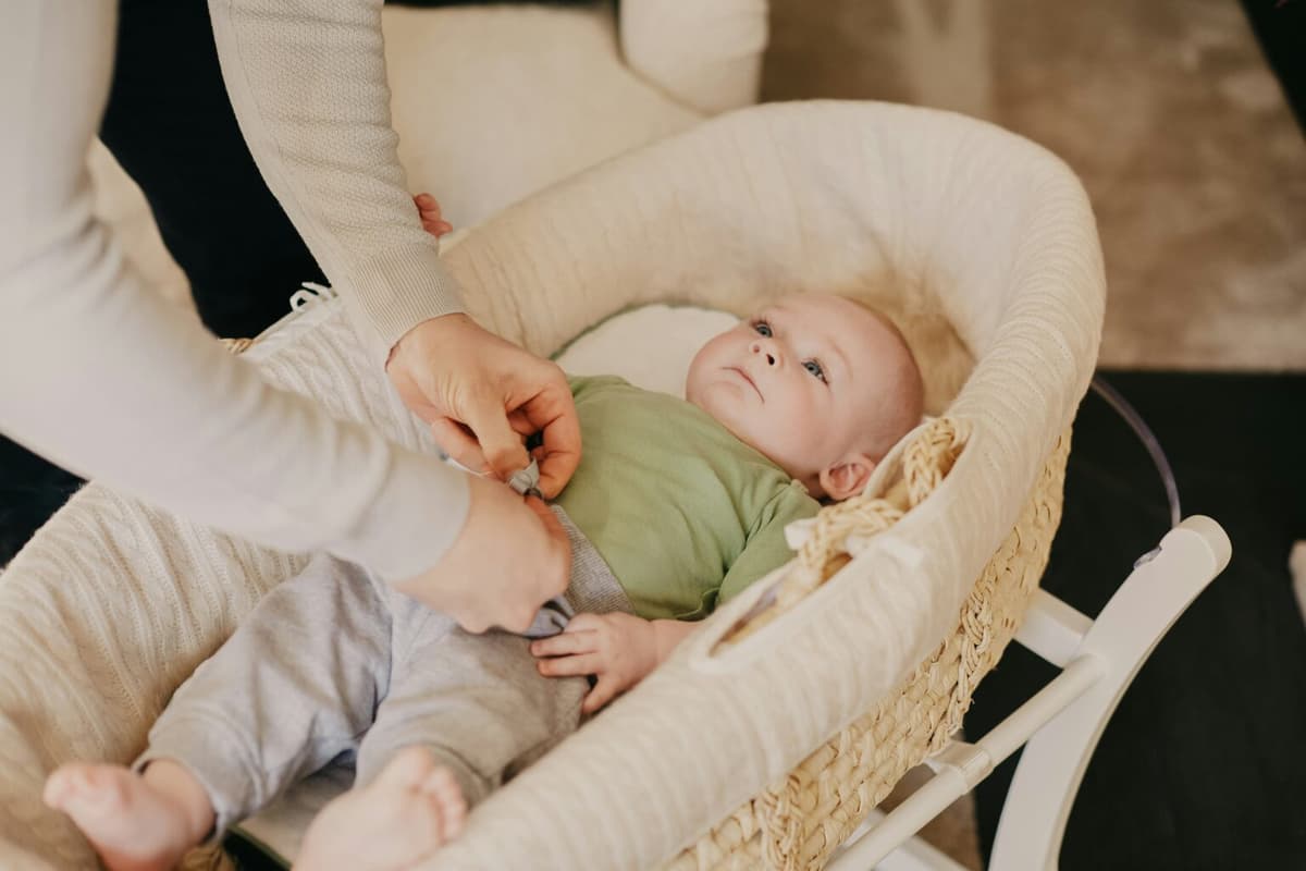 A parent gently settling a baby